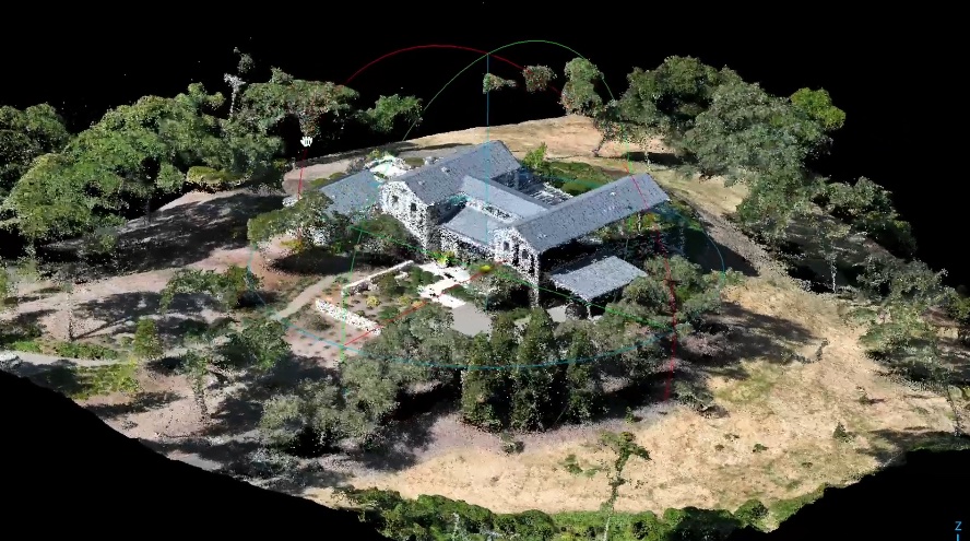 3D rendering of a house surrounded by trees on uneven terrain, with visible topography and vegetation.