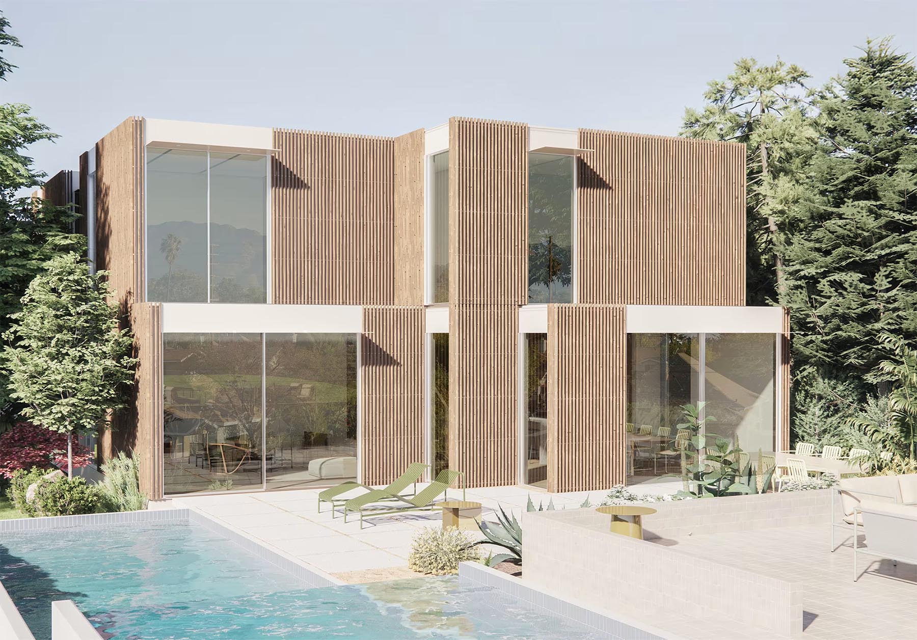 The modern prefab two-story house boasts large glass windows and vertical wooden slats. Nestled among trees, it features a swimming pool and a stylish patio area with furniture in the foreground.